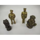 Two small gilt metal figures of a soldier and a sailor, a desk seal in the form of a cat and another