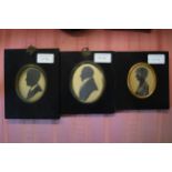 Group of five various 19th/20th Century oval mounted silhouette portrait miniatures in ebonised