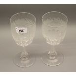 Pair of Edwardian etched glass goblets on faceted stems