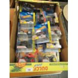 Box containing a quantity of various Hot Wheels Monster Trucks in original packaging