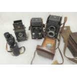 Rolleicord twin lens camera with leather case, together with a Yashica twin lens camera with leather