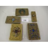 Group of five various gilt brass cigarette cases with paste inset covers