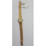 Ladies 9ct gold wristwatch by Tissot with integral bark design articulated bracelet, the champagne