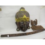Large carved and painted wall mask in the form of a head of Buddha, 24ins high together with a