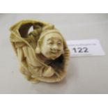 Japanese Meiji period carved ivory netsuke in the form of a seated fisherman with nets, signed
