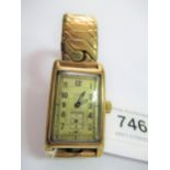 Gentleman's mid 20th Century rectangular 9ct gold cased wristwatch by J.W. Benson, London, on a