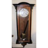 Vienna walnut and ebonised wall clock, the white enamel dial with Roman numerals and subsidiary