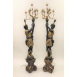 Pair of reproduction carved, gilded and ebonised lamp standards in the form of Venetian blackamoor