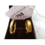22ct Gold wedding band, 2.8g together with an unmarked wedding band, 4.2g