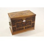 Late Victorian walnut writing compendium having dome carved hinged cover with fall front and folding