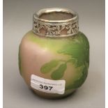 Small Galle cameo glass vase decorated with a lily pad design in green over pale pink, with a silver