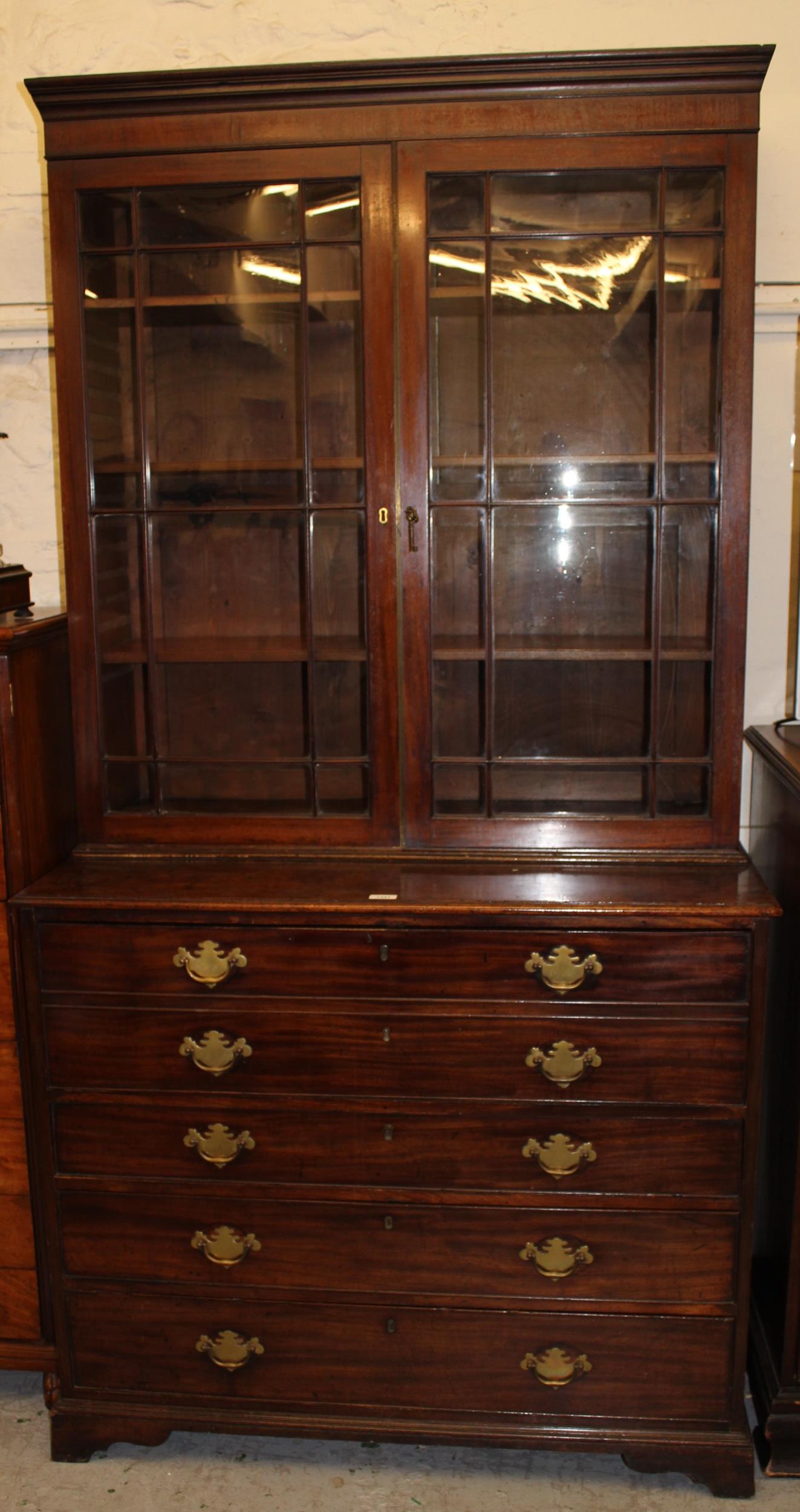 George III mahogany secretaire bookcase, the moulded cornice above a pair of bar glazed doors