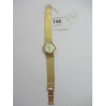 Ladies 9ct gold Omega wristwatch with integral woven bracelet, the champagne dial with baton