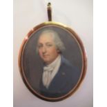 Circle of Thomas Hazlehurst, watercolour portrait miniature of a man wearing a blue coat with gold