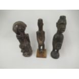 Group of three various African native carved figures