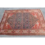 Antique Ferahan rug with an all-over stylised floral design on a midnight blue ground with corner