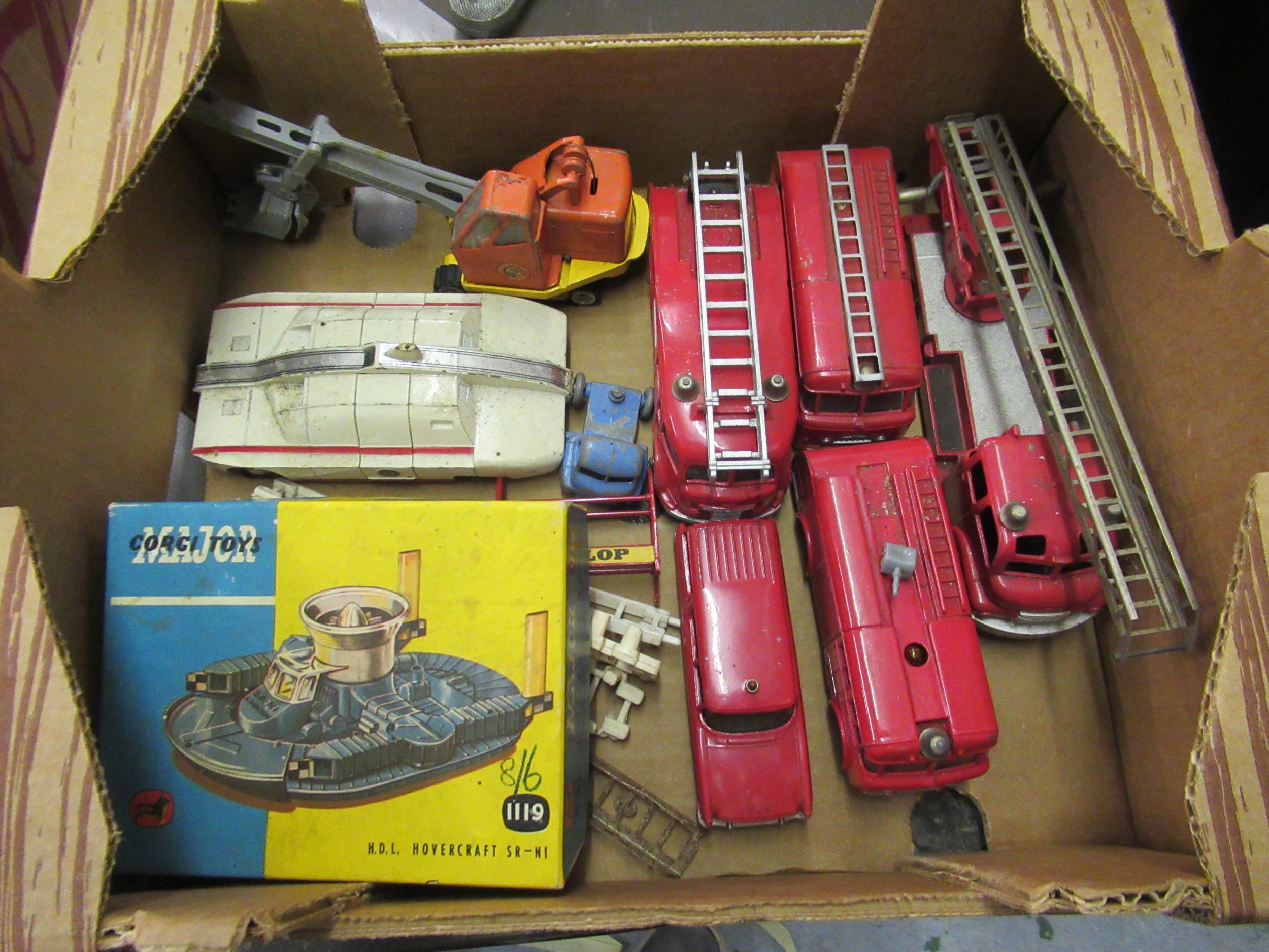Five various Dinky fire engines, a Dinky Toys maximum security vehicle, a diecast metal toy crane