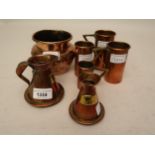 Two Scottish copper dram and half dram measures, graduated set of four copper cup measures and a