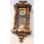 Late 19th Century walnut Vienna wall clock with eagle surmount, with a two train movement striking