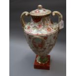 Chinese porcelain two handled pedestal vase with cover painted with panels of flowers, with an all-