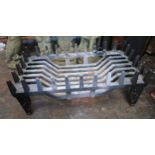Modern cast iron fire grate with castellated surround, 23ins wide