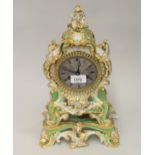19th Century French porcelain mantel clock, the Rococo design case decorated in pale green, white