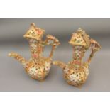 Pair of Zsolnay Pecs, Hungarian jug vases with floral relief moulded and pierced decoration (with