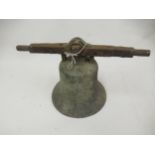 19th Century cast bronze bell (lacking clanger), mounted on an iron bar, 9.25ins diameter x 10ins