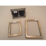 Two silver mounted photograph frames together with an unmarked white metal photograph frame