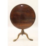 George III mahogany circular pedestal table, the dish top above a wrythen baluster column support