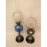 Victorian brass and glass oil lamp with blue glass well together with an oil lamp base adapted for