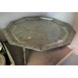 Middle Eastern silver plated Decagon tray with floral chased decoration, raised on three later brass