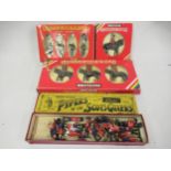Boxed Britains figures, Pipers of the Scotts Guards together with three other later boxed Britains