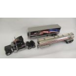 Franklin Mint model of a ' Peterbilt 379 Made in the USA ' truck, with two trailers (at fault)