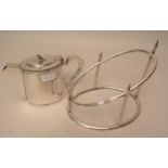 Elkington and Company silver plated ham stand, together with an Embassy oval plated teapot