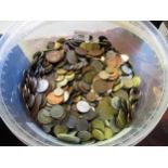 Large quantity of miscellaneous World coins in a plastic tub