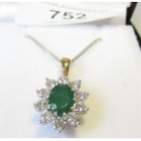 18ct White and yellow gold emerald and diamond oval cluster pendant, the emerald approximately 1.