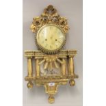 20th Century Continental wooden gilded and mirrored wall clock having circular painted dial with