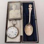 Silver Royal Commemorative spoon, miniature silver photograph frame and a silver cased fob watch
