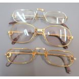 Three pairs of Cartier spectacles