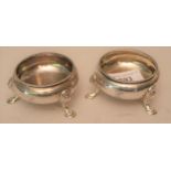 Pair of Victorian silver circular open salts with gadroon rims, each on three hoof supports,