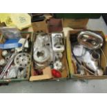 Three boxes containing a large quantity of various Harley-Davidson parts including chrome covers,