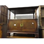 Reproduction mahogany rectangular lamp table with an alcove above two doors together with a