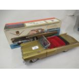 Japanese tin plate Golden Cadillac convertible battery operated model car, in original box 42cm long