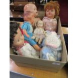 Box containing a quantity of various 20th Century plastic and composition dolls