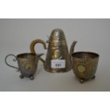 Unusual late Victorian beaten silver three piece individual coffee service of conical design,