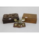 Oriental hardwood box, the hinged cover carved with a dragon in relief together with a small