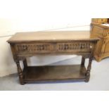 Early 20th Century oak two drawer dresser base, in antique style, with baluster turned supports