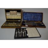 Walnut cased Walker & Hall antler handled carving set with silver finials, together with a cased set
