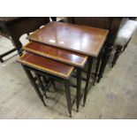 Nest of three Edwardian mahogany and inlaid occasional tables